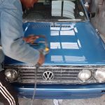 VW Golf bonnet paintwork being expertly buffed to a gloss finish by GP Motor Works