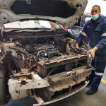 BMW 218i with our technician beginning to remove the engine at GP MotorWorks