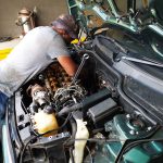 Mini Cooper S in at GP Motor Works for excessive smoking and engine noise - shows technician working on the engine