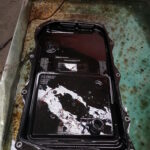 BMW F30 320d - old gearbox sump showing built-in oil filter as part of gearbox service at GP Motor Works