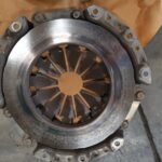 Badly worn flywheel showing excessive wear and hotspots undergoing replacement at GP Motor Works