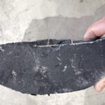 Part of a Diesel Particulate Filter (DPF) which is completely blocked up with soot and contaminants