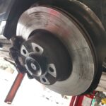 BMW 328i brake disc showing damage in for repair at GP Motor Works