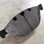 BMW new brake pad showing chamfer and dust slot at GP Motor Works