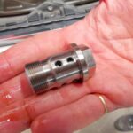 Mini Cooper closeup view of central valve vanos bolt in for replacement at GP Motor Works