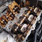 Mini Cooper engine bay with cracked exhaust Vanos in for replacement at GP Motor Works