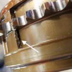Mini Cooper closeup view of cracked exhaust Vanos in for replacement at GP Motor Works