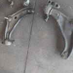 Mini Cooper - damaged control arms and bushes being replaced on car in for diagnosis of suspension knock at GP Motor Works