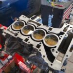 BMW 228i testing new pistons for any leakage prior to completing engine rebuild at GP Motor Works